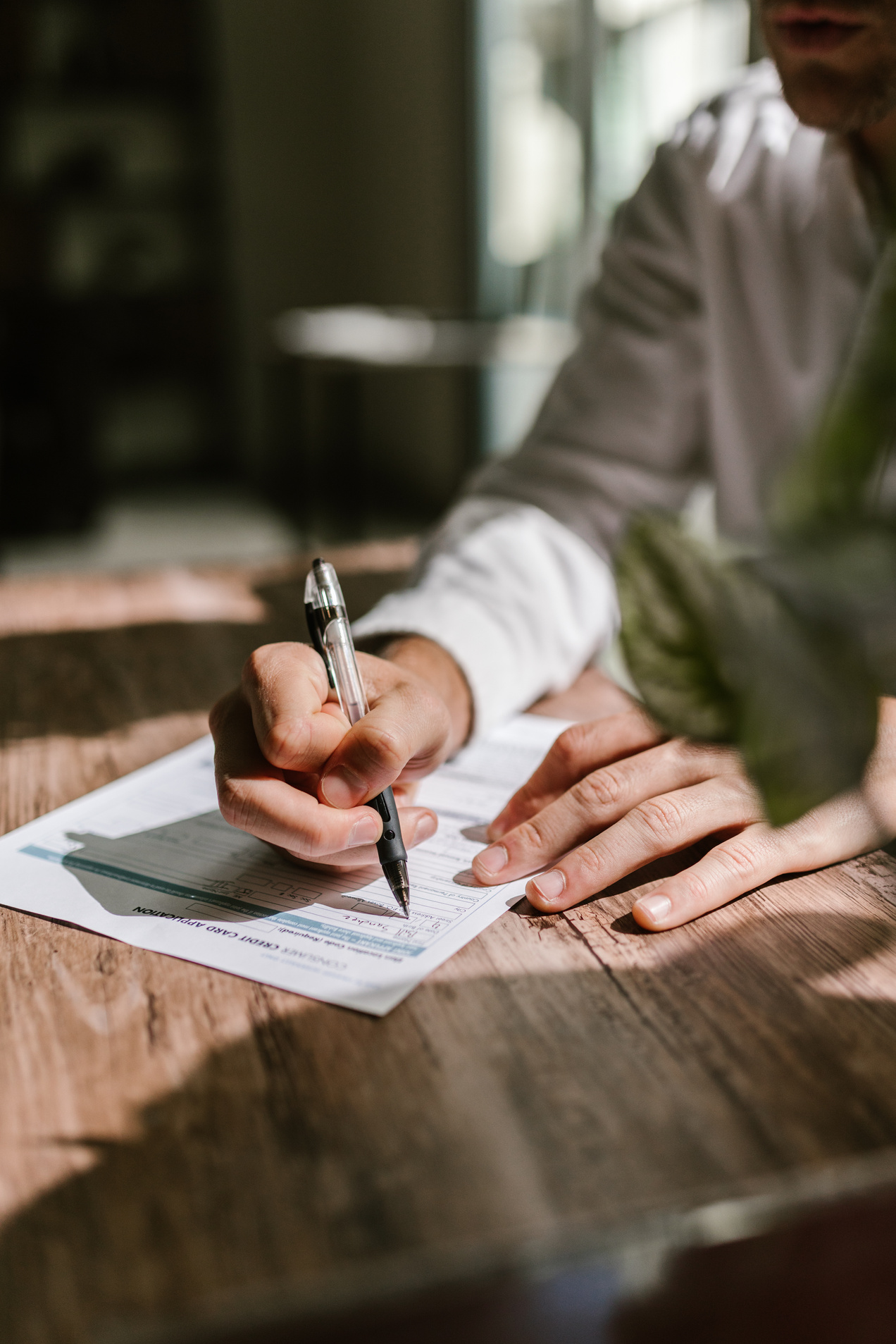 Man Writing On A Form